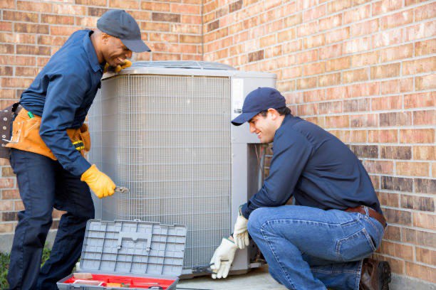 Ruby's Air technician performing a new AC unit installation in a Central Arkansas home